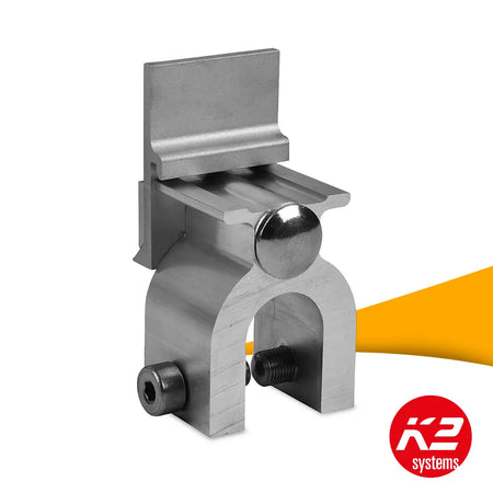 K2 Rundfalzklem CF:x Single Round SeamClamp 2002859 kopen bij solago.nl, klem voor montagerails op witte achtergrond met oranje podium productfoto
